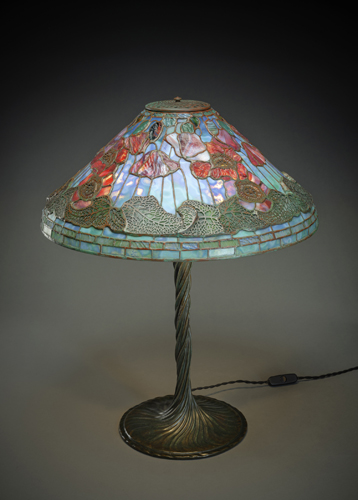<b>A LARGE BRONZE AND LEAD GLASS TABLE LAMP IN THE MANNER OF TIFFAY</b>