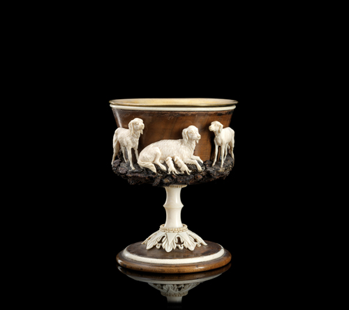 <b>AN ALPINE CARVED WOOD AND IVORY CUP WITH DOGS</b>