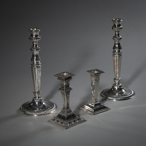<b>A PAIR OF CANDLESTICKS AND TWO SMALLER CANDLESTICKS</b>