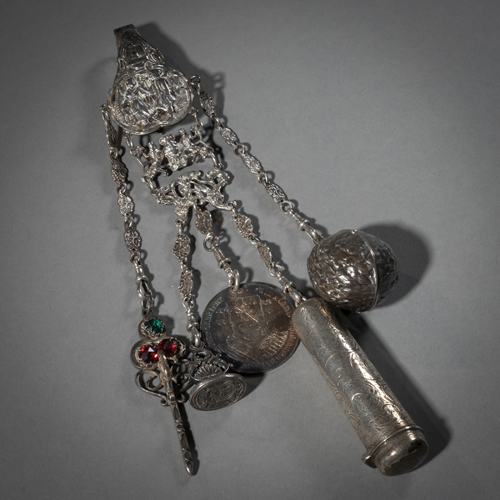 <b>A SILVER CHATELAINE WITH PENDANTS</b>