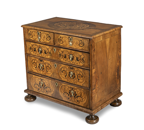 <b>An English brass mounted walnut, maple, sycamore and fruitwood marquetry commode</b>