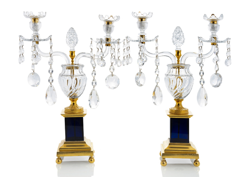 <b>A pair of gilt bronze and pressed glass twin light girandoles</b>