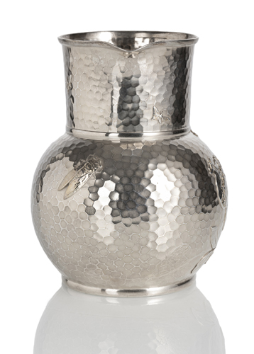 <b>A LARGE HAMMERED SILVER JUG WITH POMEGRANATE PATTERN</b>