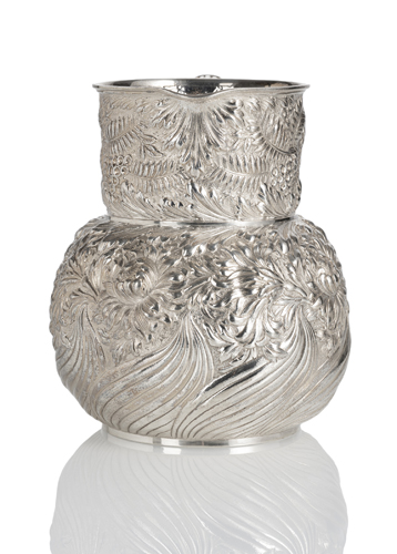 <b>A LARGE HAMMERED SILVER WATER JAR WITH FLORAL PATTERN</b>