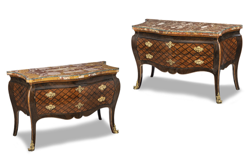 <b>A PAIR OF ITALIAN ORMOLU MOUNTED BOIS SANTINE AND AMARANTH PARQUETRY COMMODES</b>