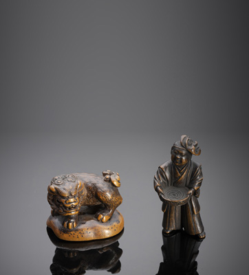 <b>TWO CARVED WOODEN NETSUKE</b>