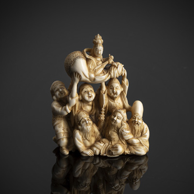 <b>A VERY FINE CARVED IVORY GROUP OF THE SEVEN GOOPDS OF LUCK</b>