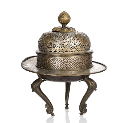 <b>A BRONZE AND REPOUSSÉ THREE-LEGGED CHARCOAL STOVE FOR THE ALTAR ROOM</b>