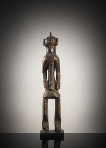 <b>A standing wood figure</b> <b>A standing wood figure</b>