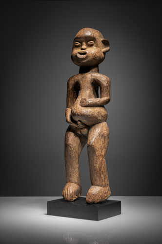 <b>A standing Bamileke wood figure</b> <b>A standing Bamileke wood figure</b>