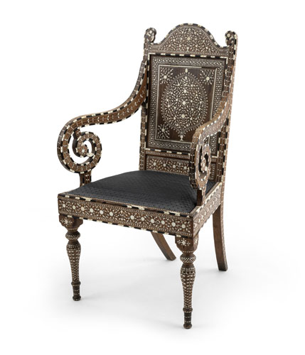 <b>An upholstered bone-inlaid armchair with intricate floral designs</b> <b>An upholstered bone-inlaid armchair with intricate floral designs</b>
